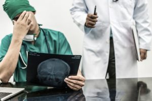 Doctor reviewing a brain injury case